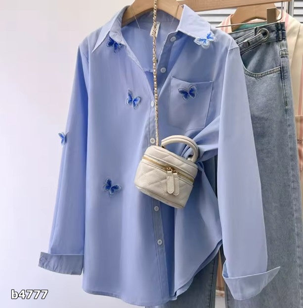 Blusa celeste con mariposas manga larga oversized