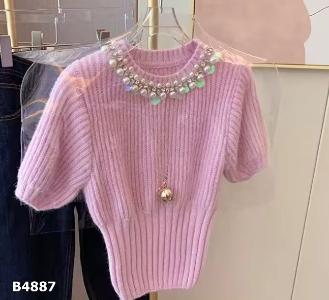 Blusa rosa manga corta de tela de punto con pedrería