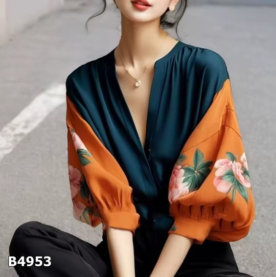 Blusa verde con estampado naranja