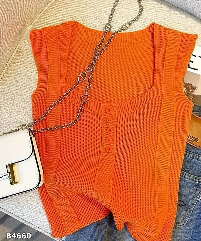 Blusa naranja desmangada tela de punto